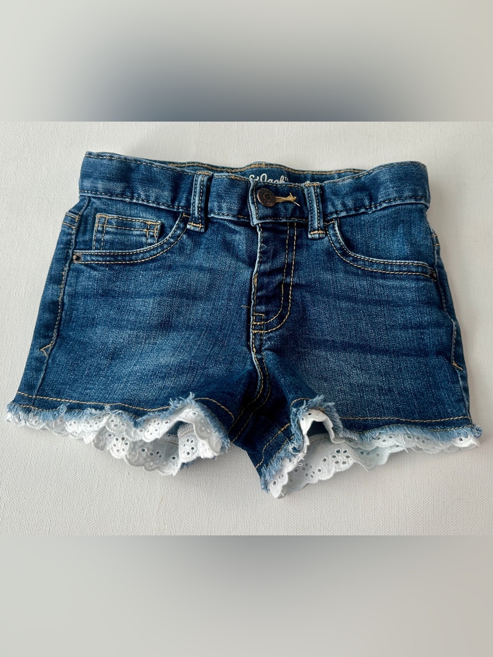 Cat & Jack girlโs lace cut-off denim Shorts with White Lace Trim. Size 4T.
